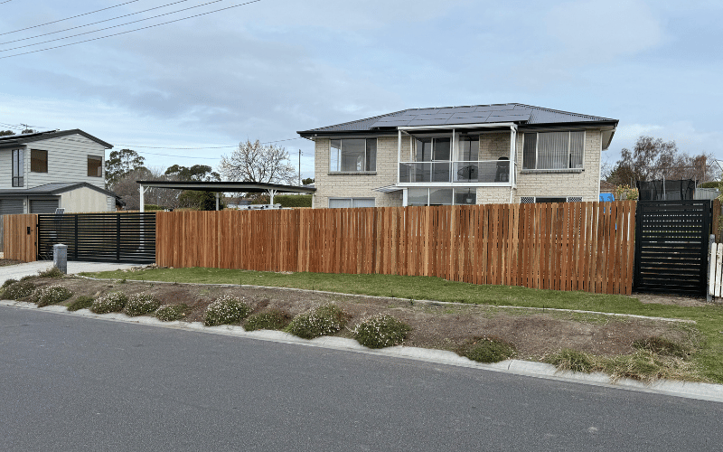 Timber fencing with steel sliding gate installed by hobart fencing and gates best fencing contractors in Hobart, TAS 7